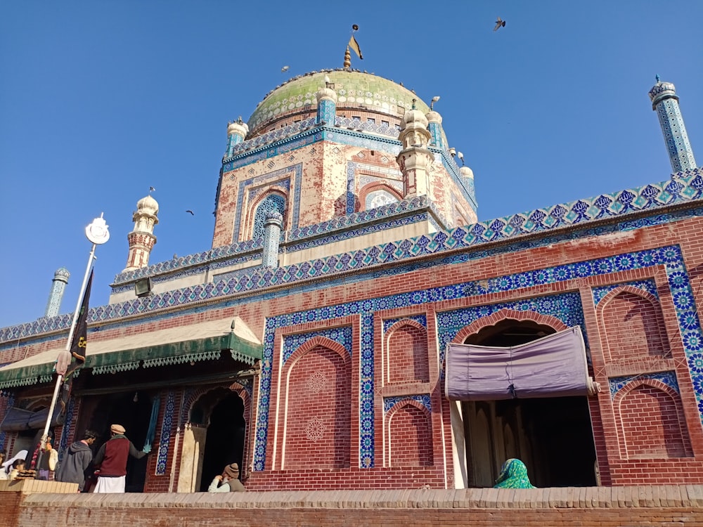 a blue and red building with a dome on top