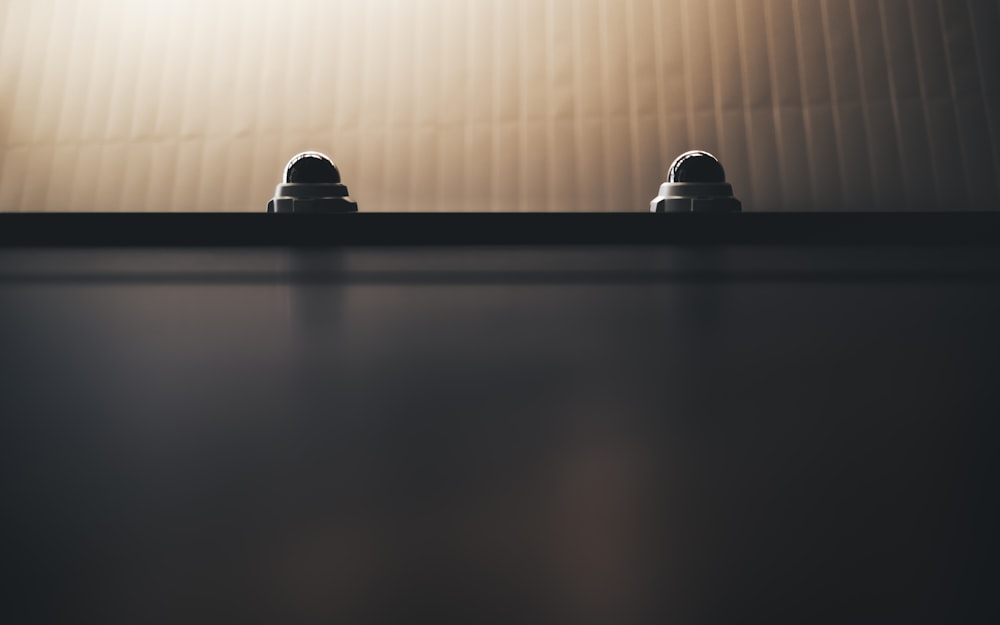 a person sitting at a table in a dark room