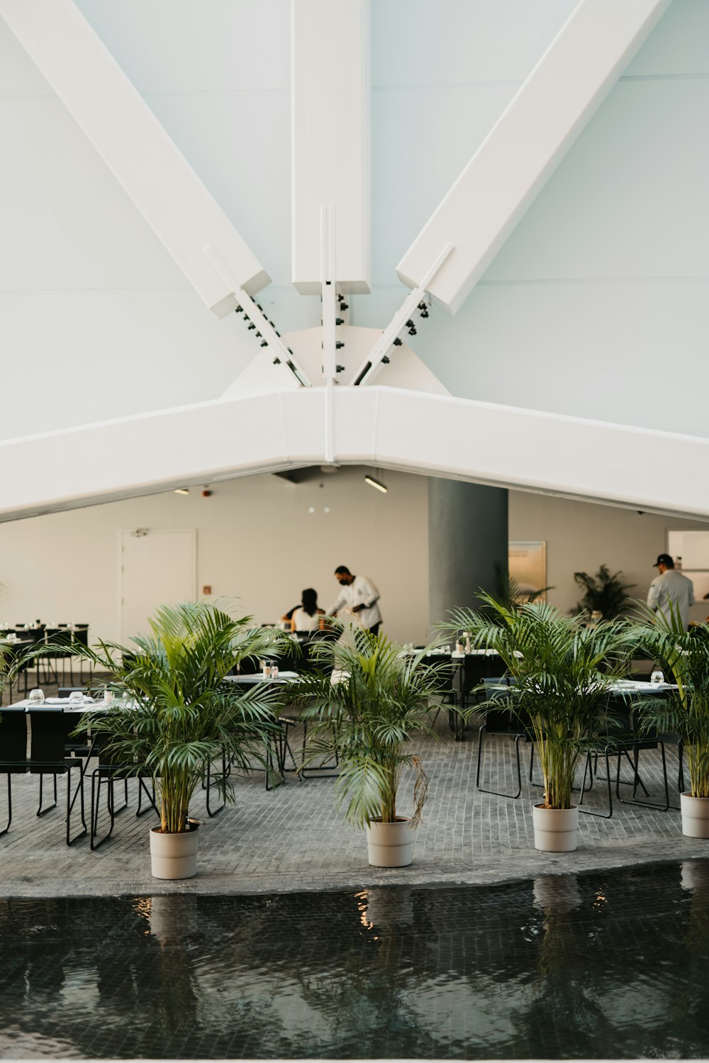 a group of people sitting at tables in a room