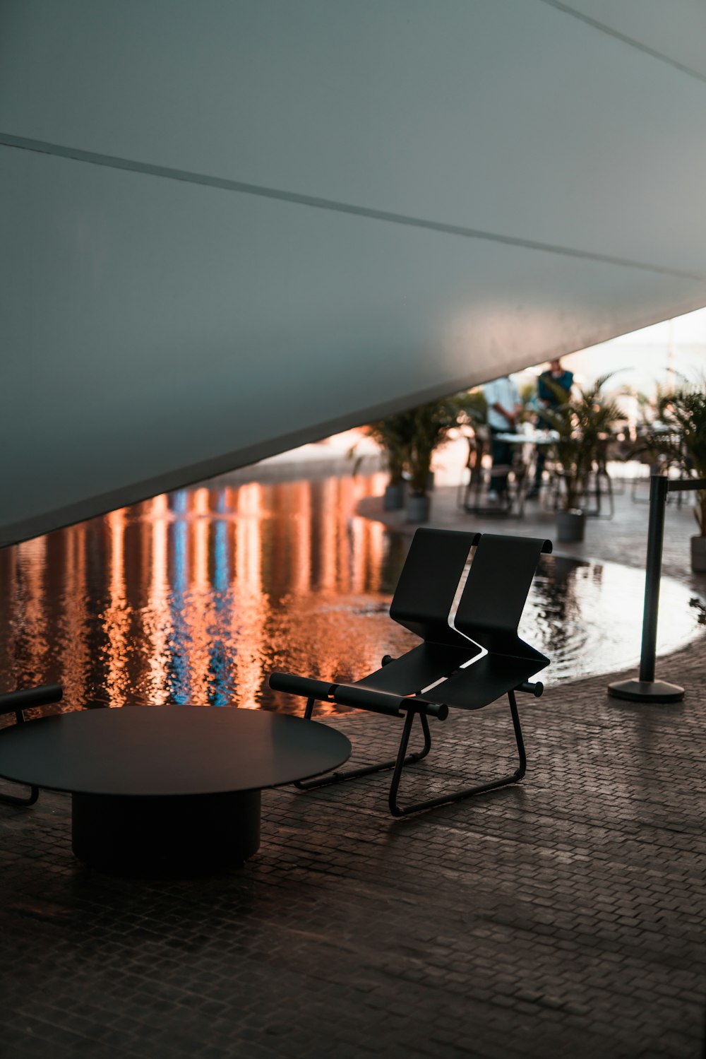 a chair and a table under a roof