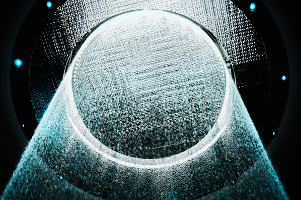 a circular object is shown in the middle of a dark background