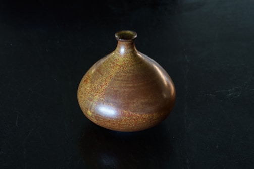 Elegant ceramic vase with subtle natural textures and earthy tones.