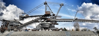 a large crane sitting on top of a cement stadium