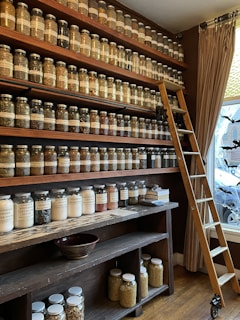 a room filled with lots of jars and a ladder