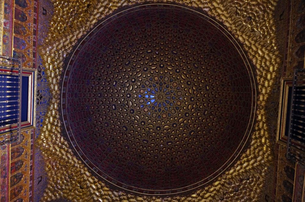 a decorative ceiling in a building with a circular design