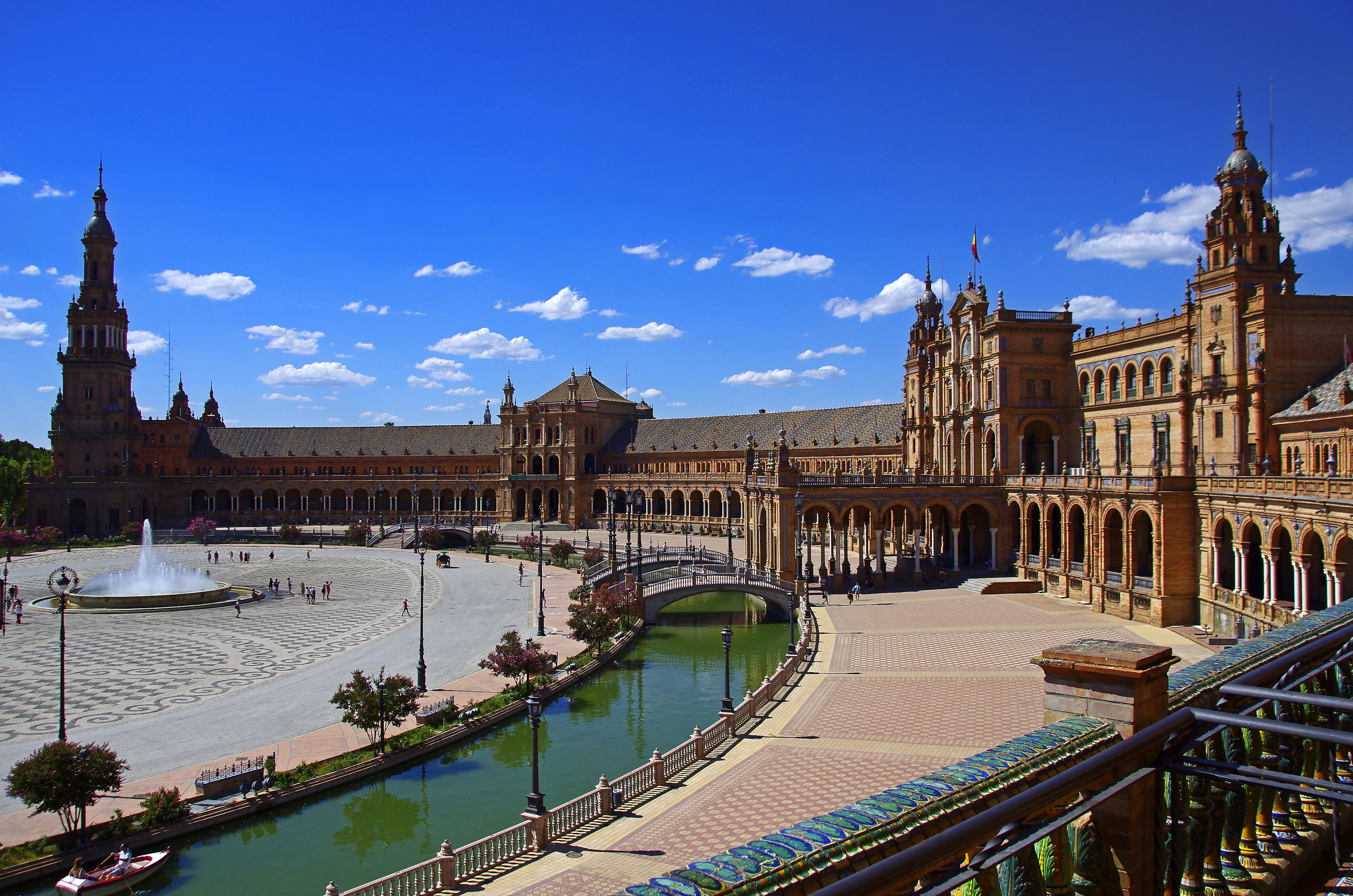 The Plaza de España in Seville: its semicircular building, towers, canal and fountain
