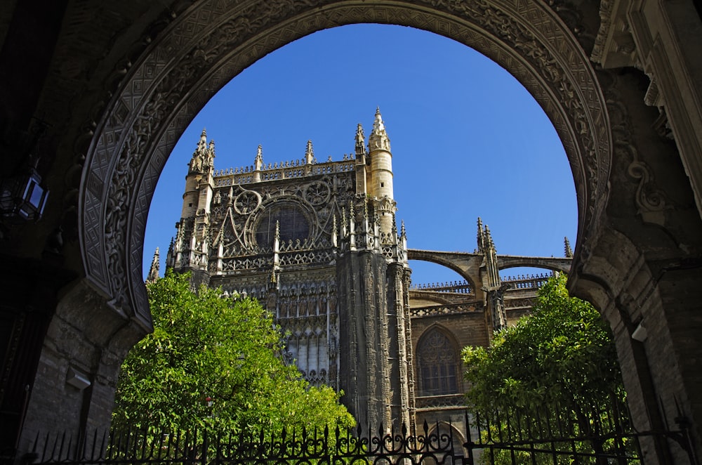 a view of a cathedral through a gate