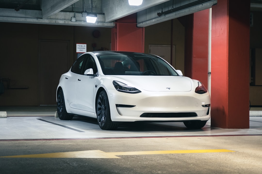 a white car parked in a parking garage,