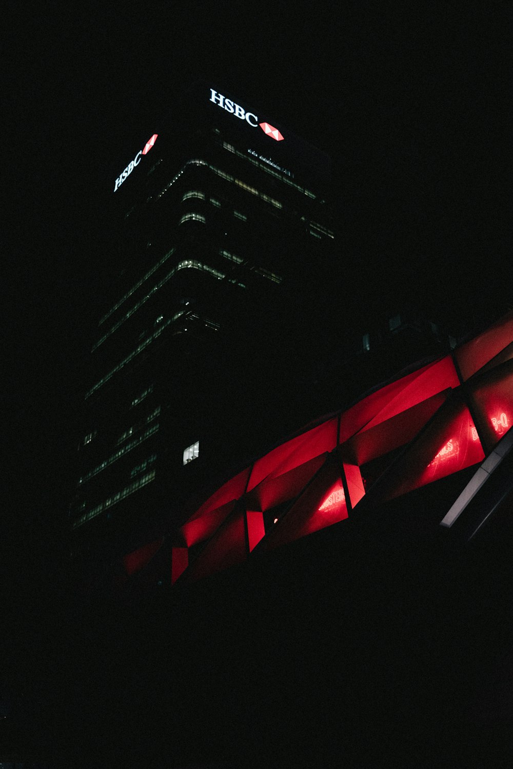a tall building lit up in the dark