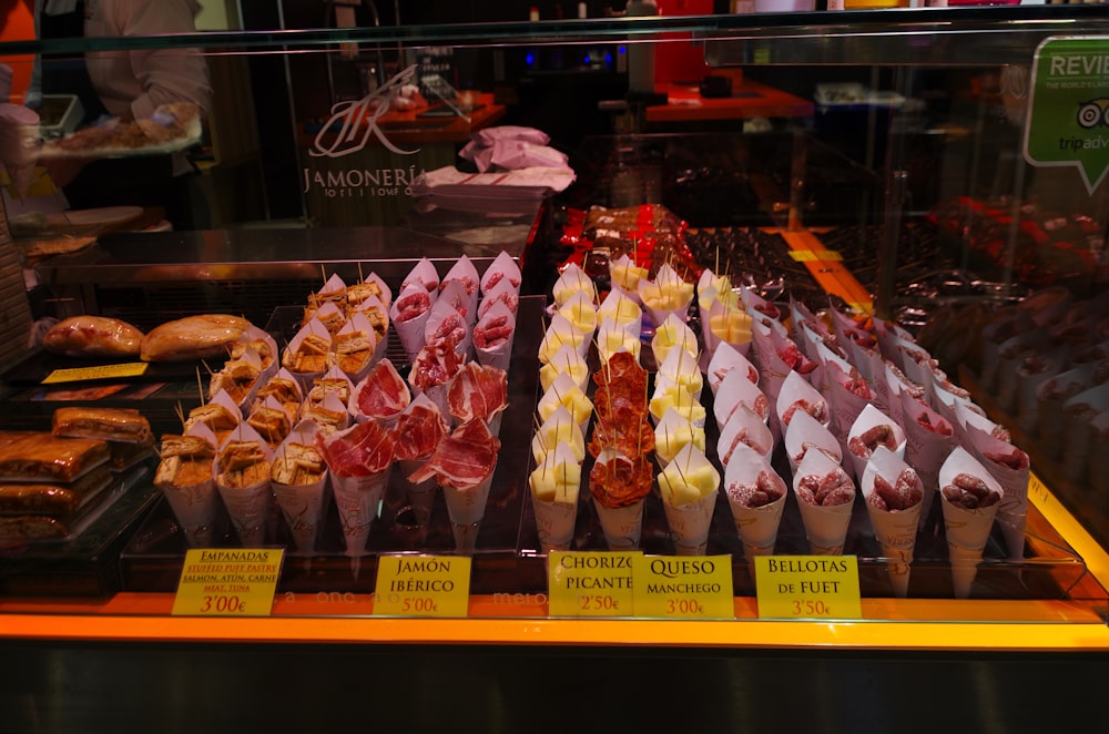 a display case filled with lots of different types of food