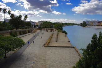 View of the Malecon del Rio in Barranquilla with people enjoying the waterfront promenade.