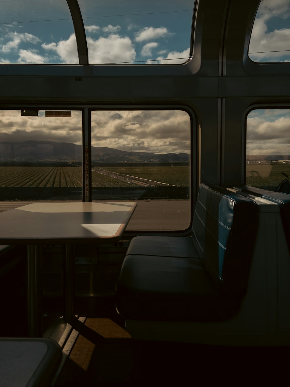a table and chairs in a train car