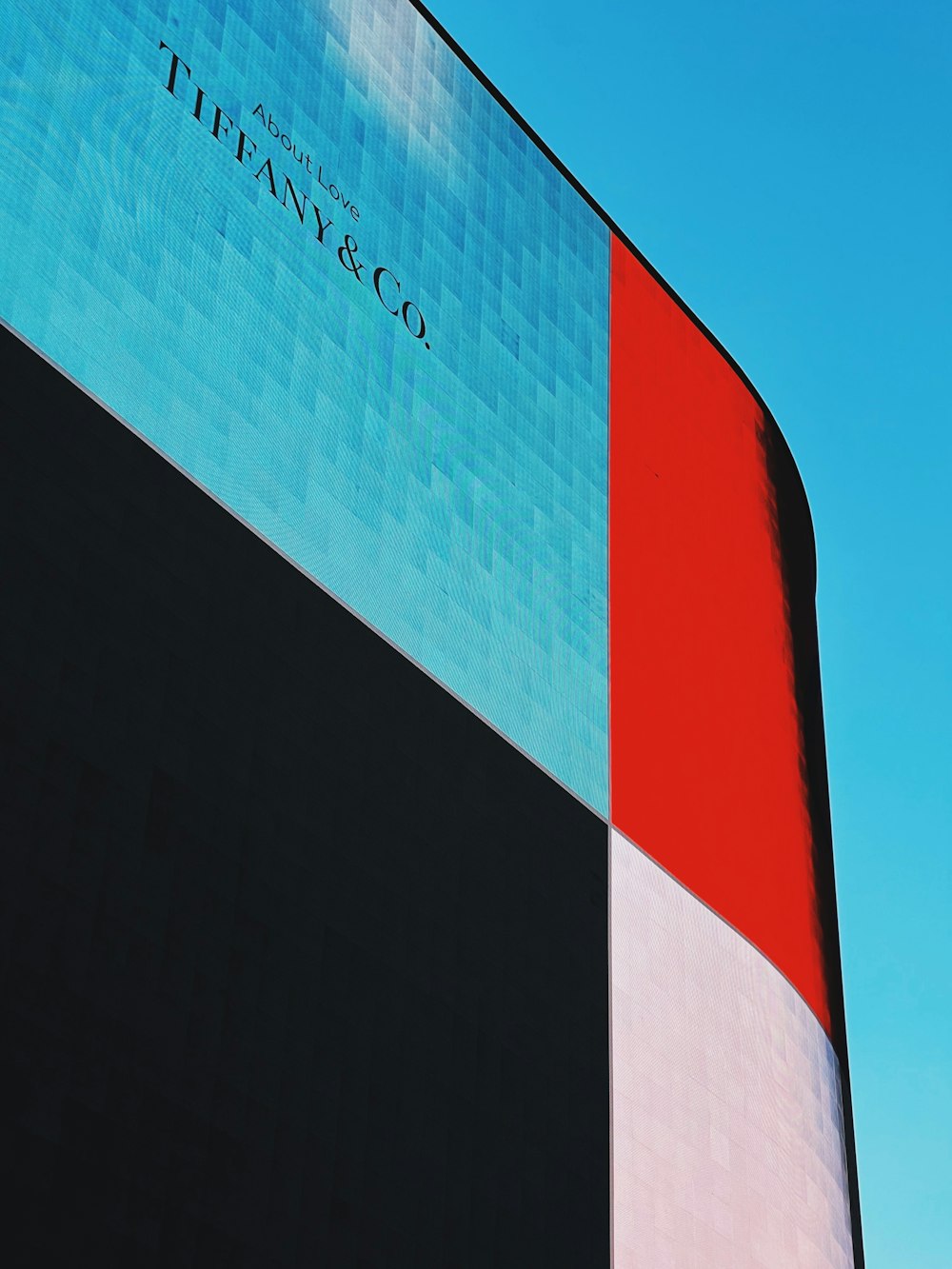 a tall building with a blue sky in the background