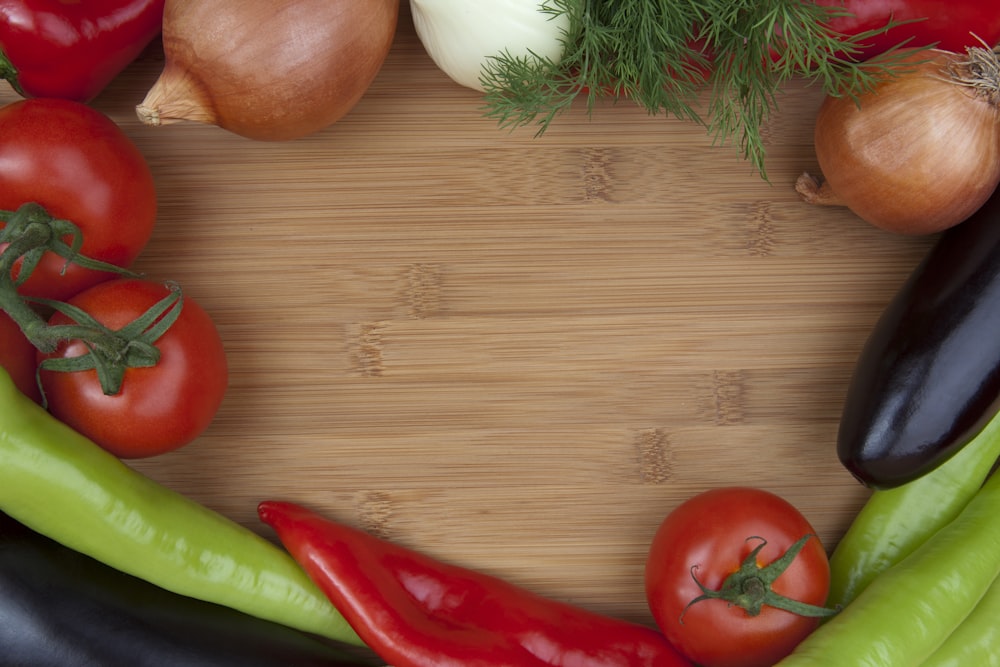 a group of vegetables sitting on top of a wooden table