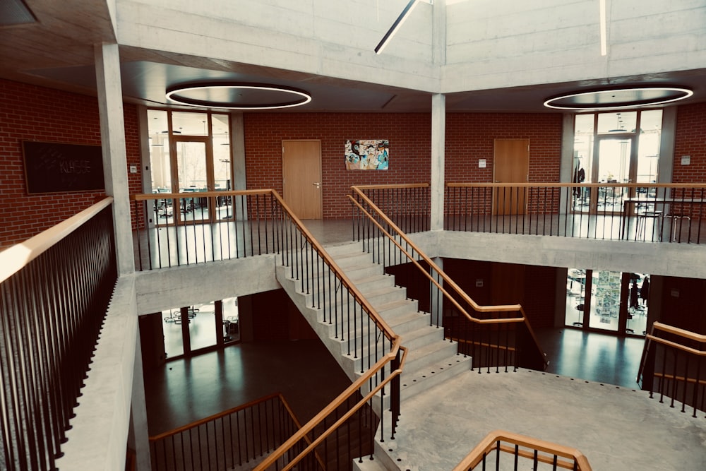 a spiral staircase in a building with brick walls