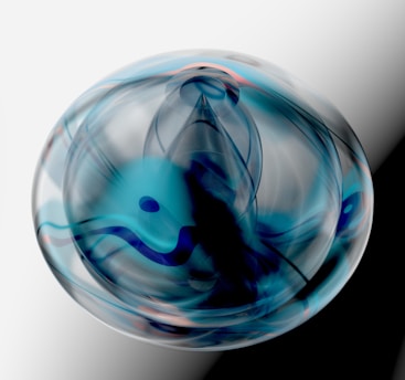 a glass ball with a blue swirl inside of it