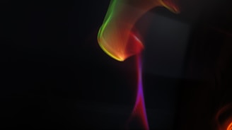 A colorful, psychedelic swirl blending shades of purple, blue, and pink.