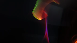 Vibrant psychedelic swirl background with bold colors blending seamlessly into a grayish backdrop.