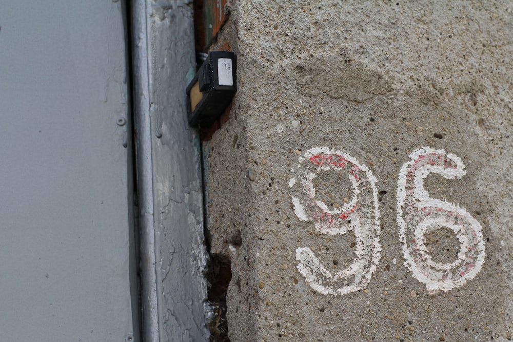 a close up of a number on a wall