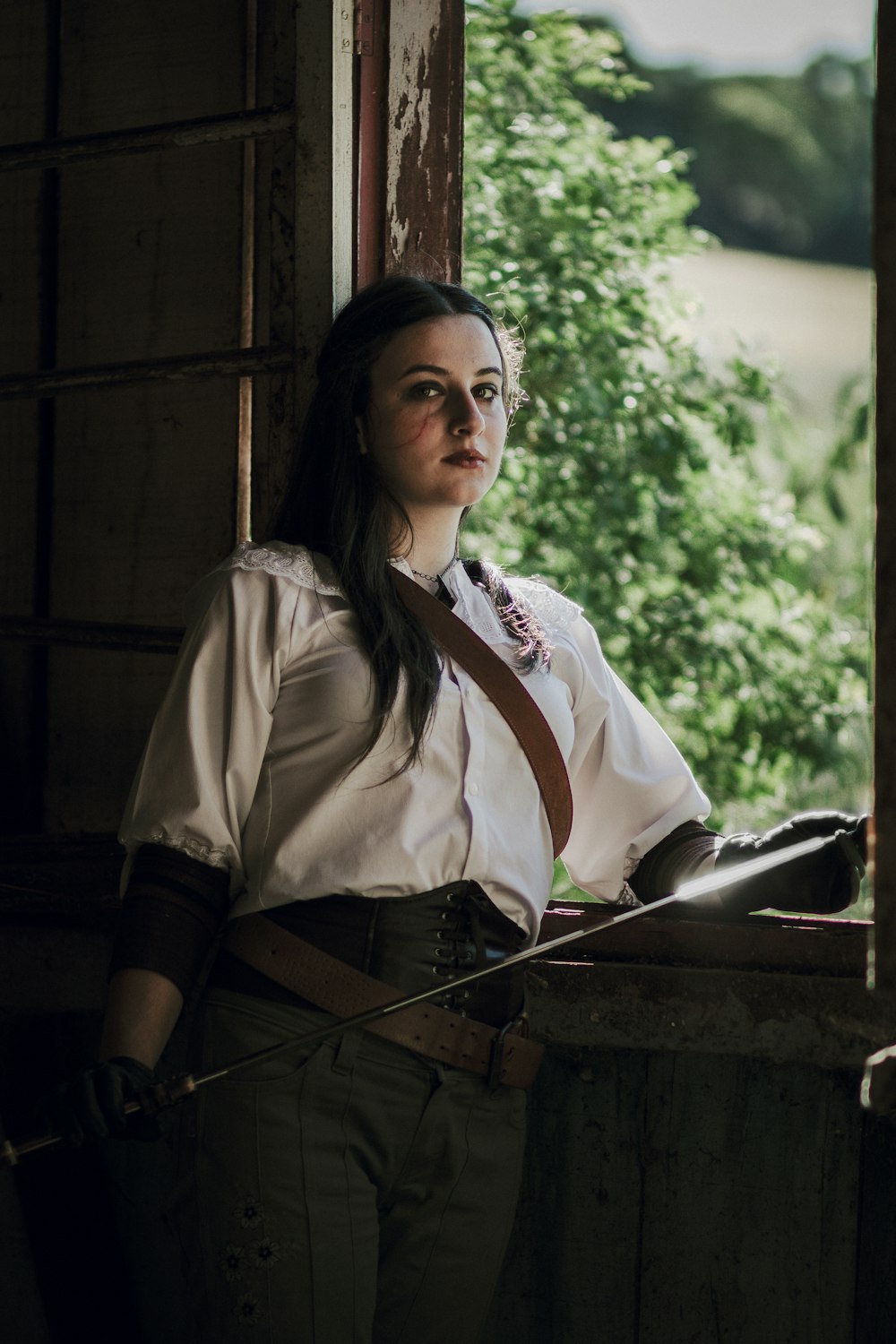 a woman in a white shirt and brown tie