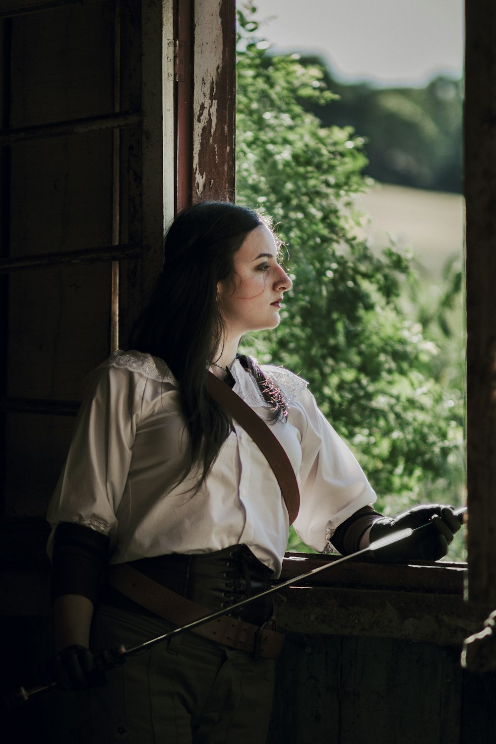 a woman in a white shirt and brown tie