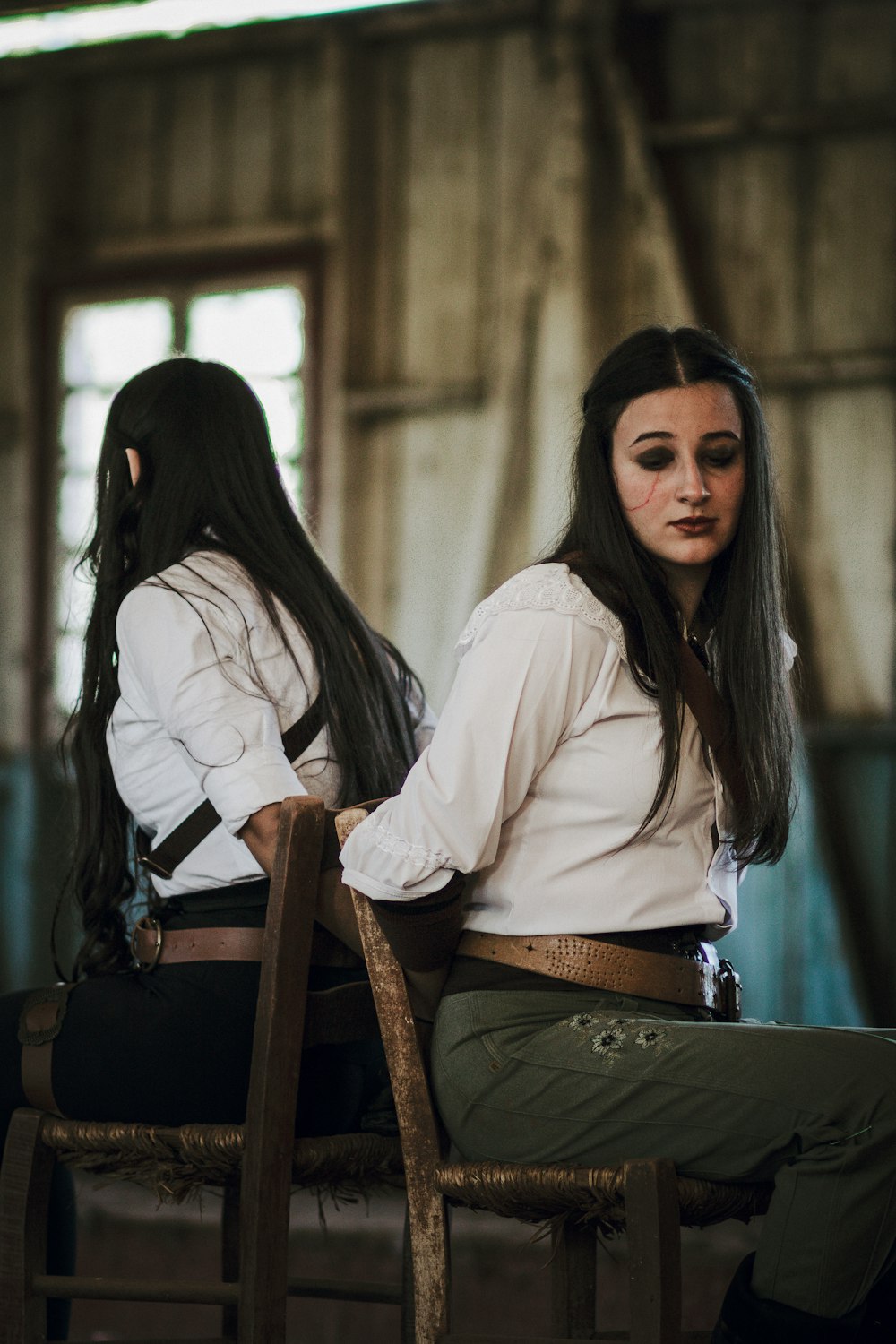 a couple of women sitting next to each other