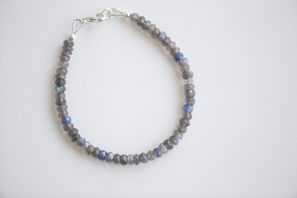 a beaded bracelet with a silver clasp