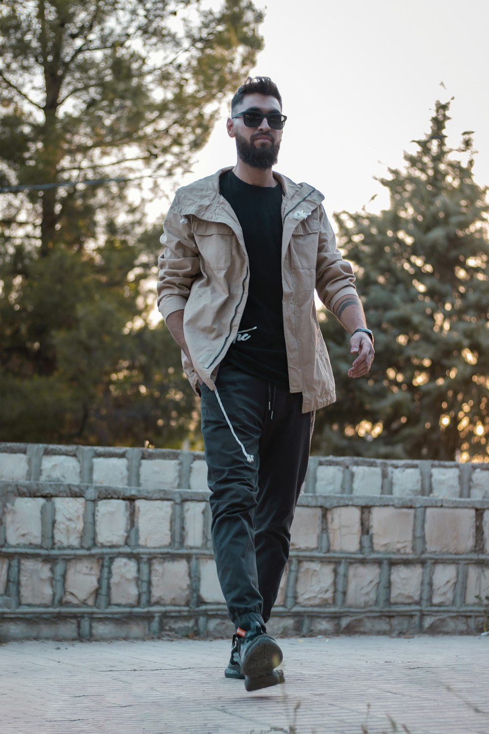 a man riding a skateboard down a sidewalk