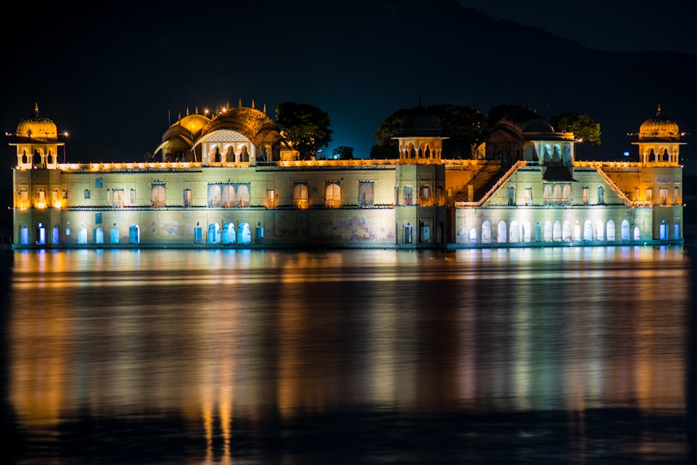 a large building sitting on top of a body of water