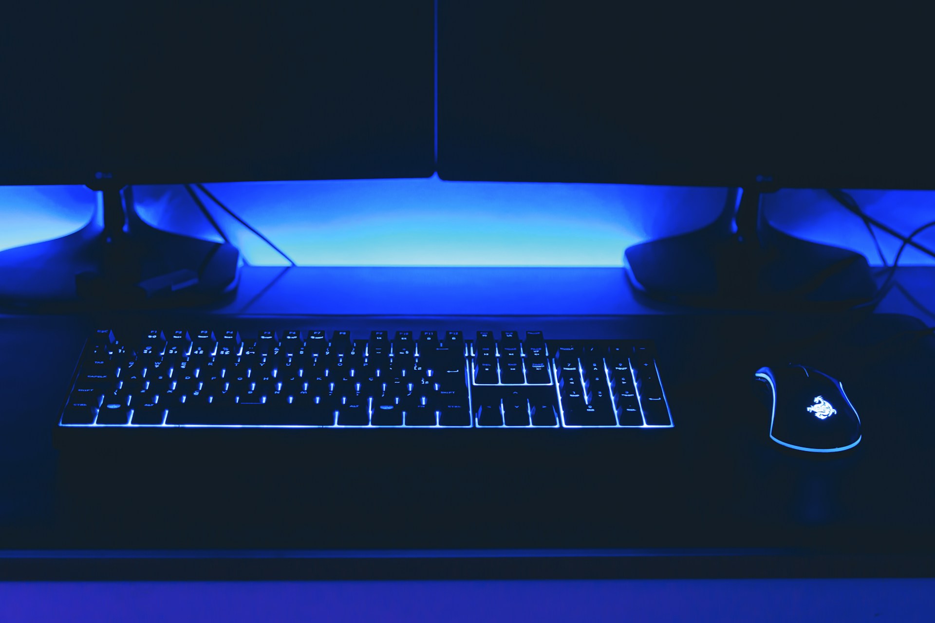 a computer desk with a keyboard and mouse