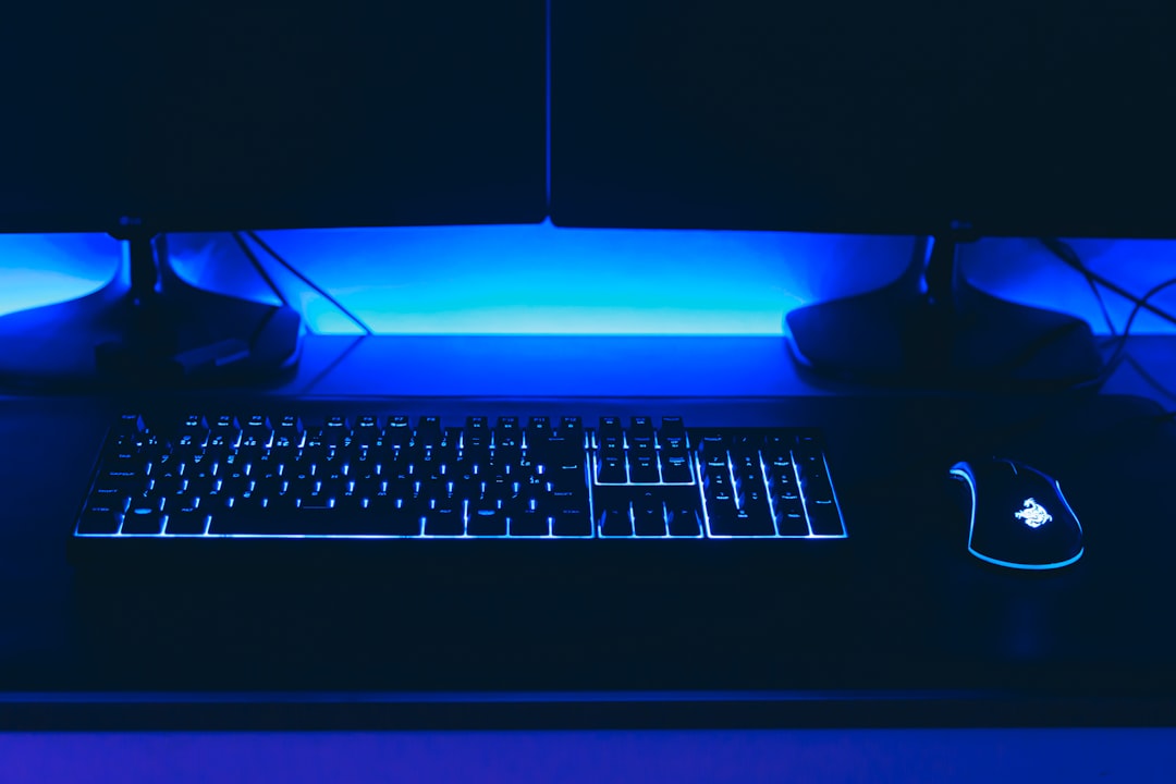 a computer desk with a keyboard and mouse, board rgb (cyan)