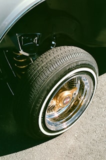 A close-up of a clean truck tire shining in the sunlight.