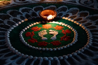 a lit candle sitting on top of a table