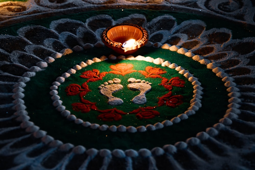 a lit candle sitting on top of a table