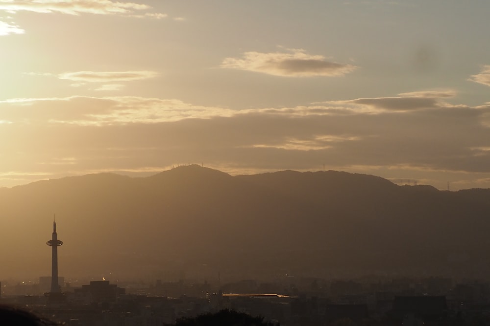 a view of a city with mountains in the background