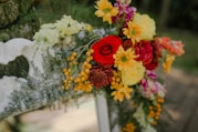 a bunch of flowers that are sitting on a bench