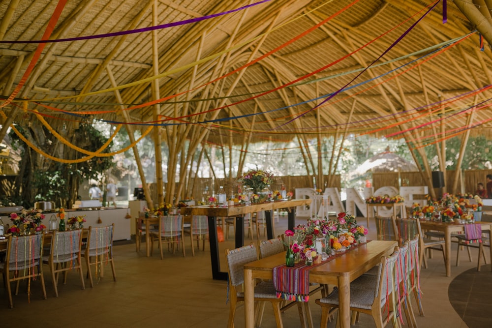 a dining area with tables, chairs, and umbrellas
