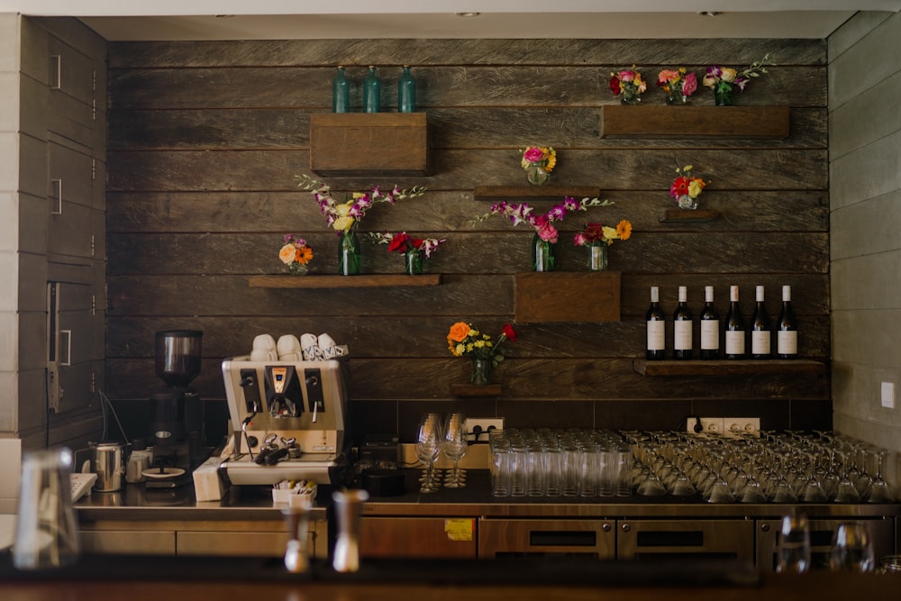 a coffee shop with flowers on the wall