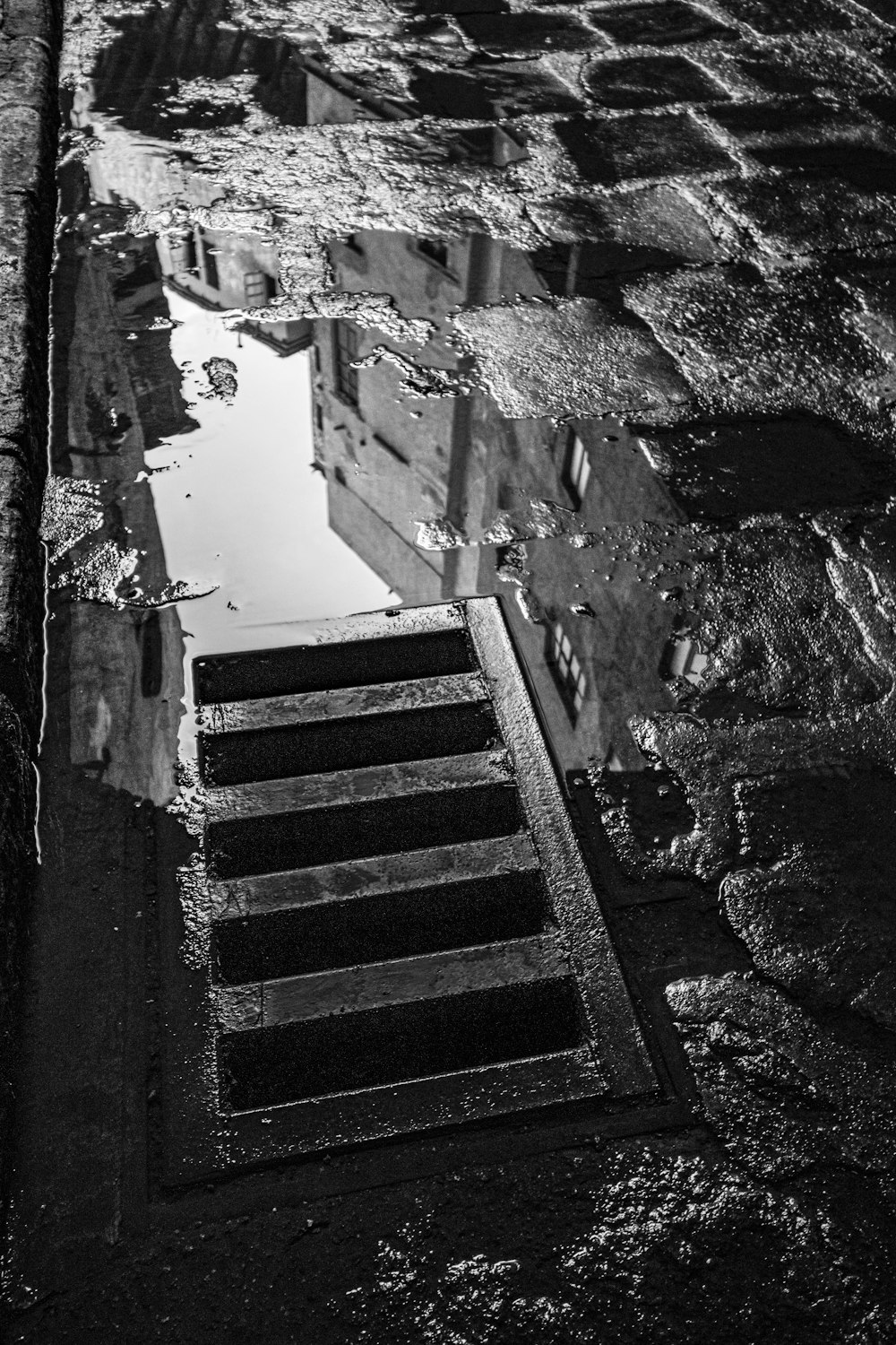 a black and white photo of steps leading to a building