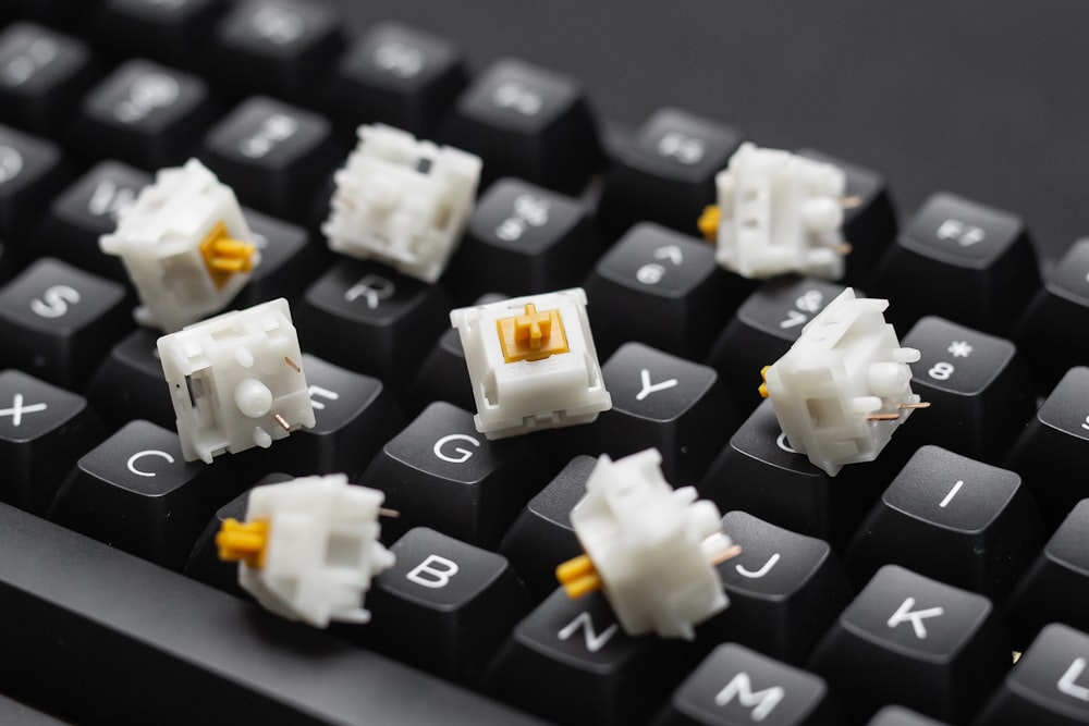 a close up of a keyboard with some white keys