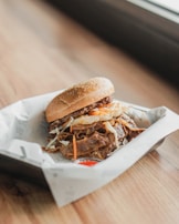 a sandwich sitting on top of a white wrapper