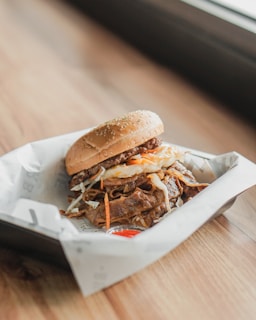 a sandwich sitting on top of a white wrapper