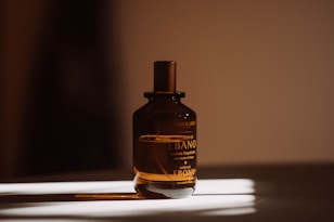 a bottle of perfume sitting on a table