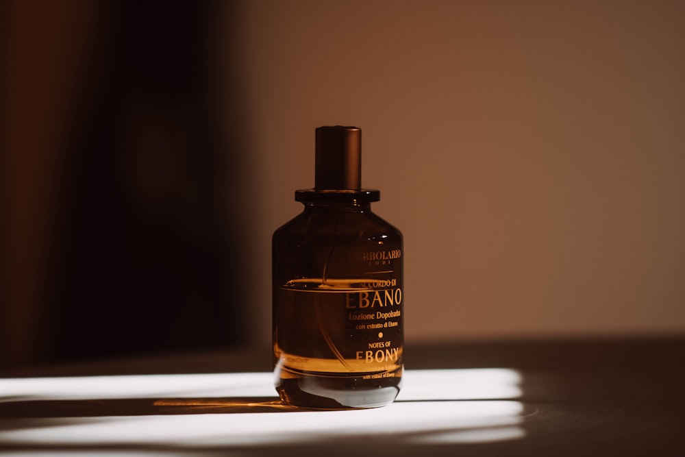 a bottle of perfume sitting on a table