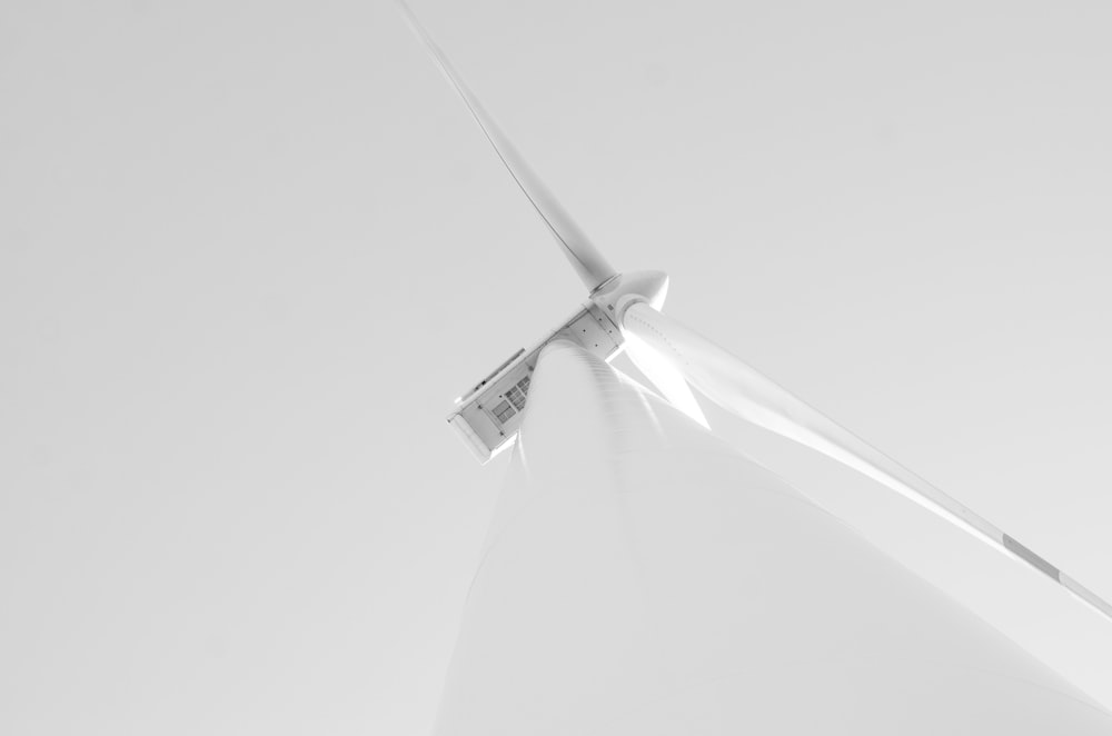 a wind turbine is shown in black and white