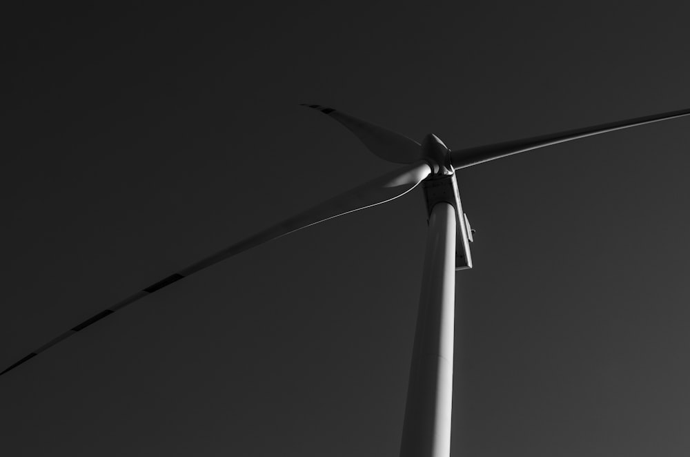 a black and white photo of a wind turbine