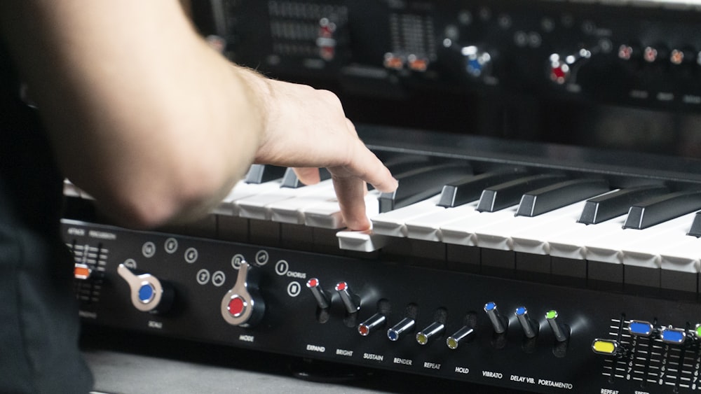 a person touching the keys of a keyboard