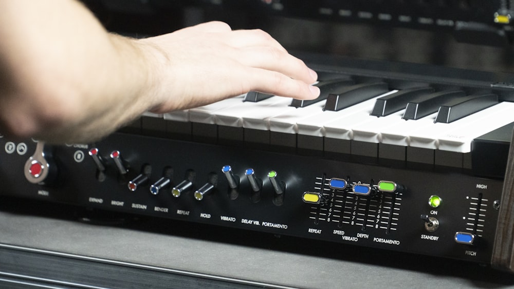 a person playing a keyboard on a stage