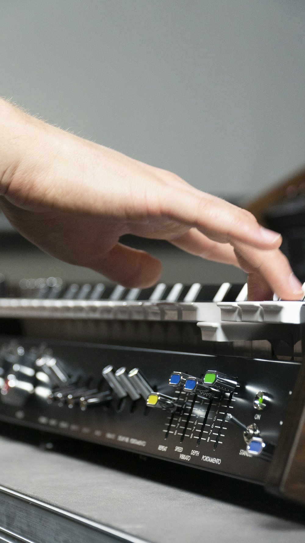 a person is playing a keyboard on a table