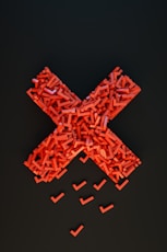 a cross made out of small pieces of red plastic